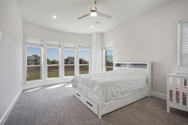 Carpeted bedroom with baseboards, recessed lighting, and ceiling fan | Image 16