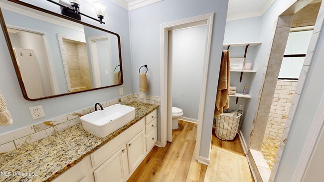 Full bath down off the living area | Image 49