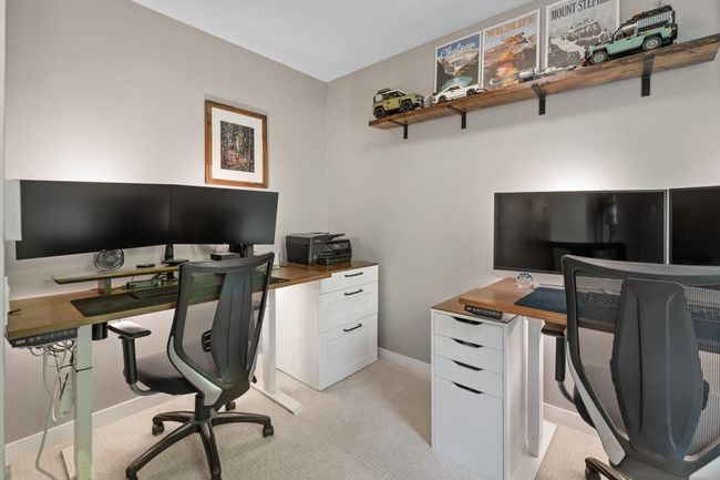 Home office with light colored carpet and baseboards | Image 33