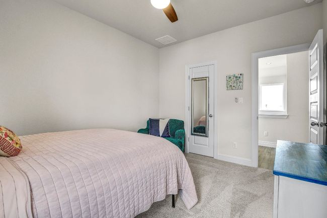 Bedroom with carpet floors and a ceiling fan | Image 29
