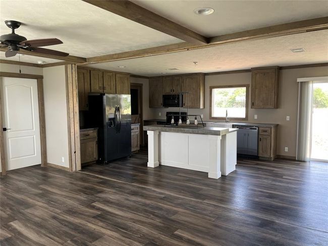 A three bedroom and two bathroom home offering a spacious living arrangement | Image 4