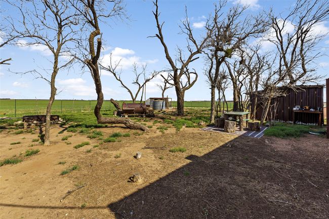 View of yard with a rural view, an outbuilding, and fence | Image 21