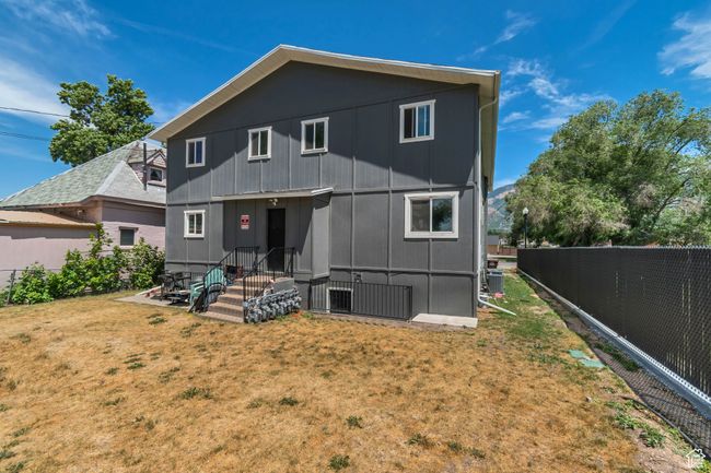 Rear view of property with a fenced backyard | Image 16