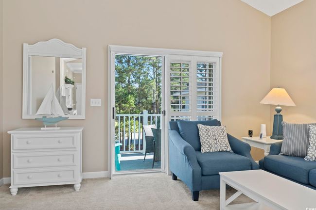 Living room featuring light colored carpet and baseboards | Image 18