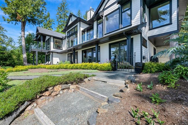 Rear view of property with uncovered parking and a chimney | Image 23