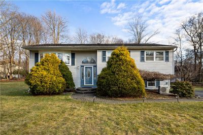 Split foyer home with a front yard and ac unit | Image 1