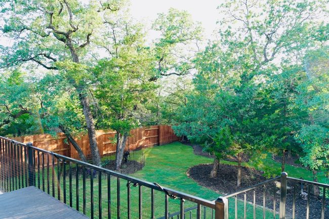 View of fenced backyard | Image 26