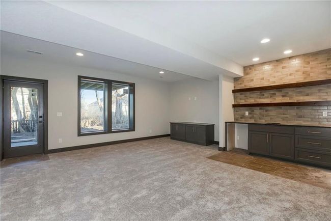 Unfurnished living room featuring light colored carpet, recessed lighting, and baseboards | Image 23