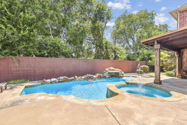 View of pool with an in ground hot tub and a patio area | Image 31