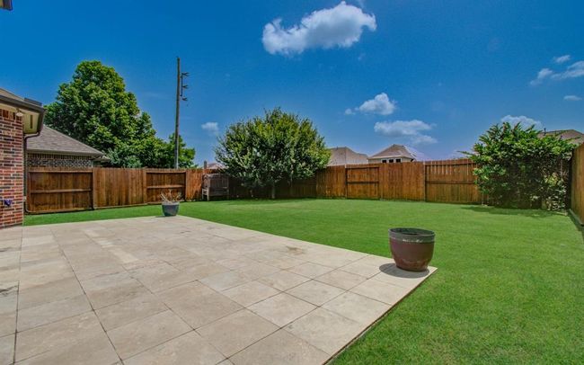 No immediate back neighbors. Backyard faces east so will get afternoon shade. Stained fence and well kept green lawn make for a truly nice and usuable backyard space. | Image 41