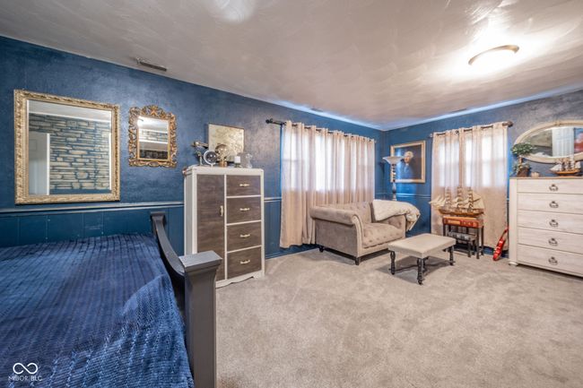 bedroom with carpet flooring and visible vents | Image 9