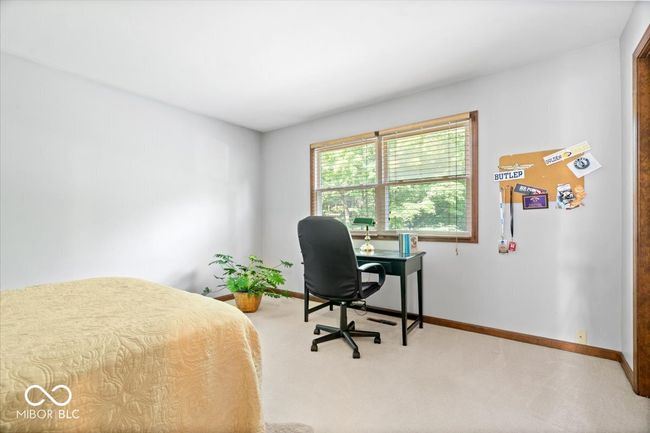 bedroom with carpet floors and a desk | Image 27