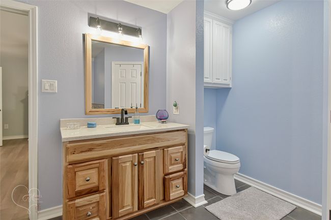 Bathroom featuring vanity and tile patterned flooring | Image 25