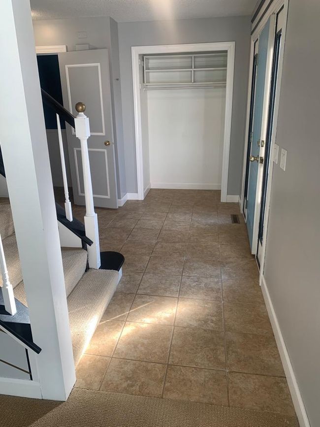 Tiled foyer with nice sized closet | Image 14