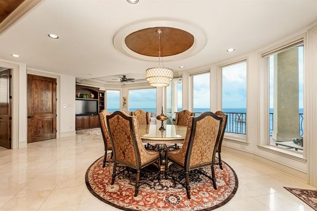 formal dining area that is still part of the open concept to kitchen and living areas | Image 22