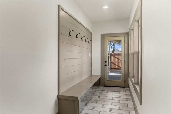 Mudroom featuring brick flooring and recessed lighting | Image 34