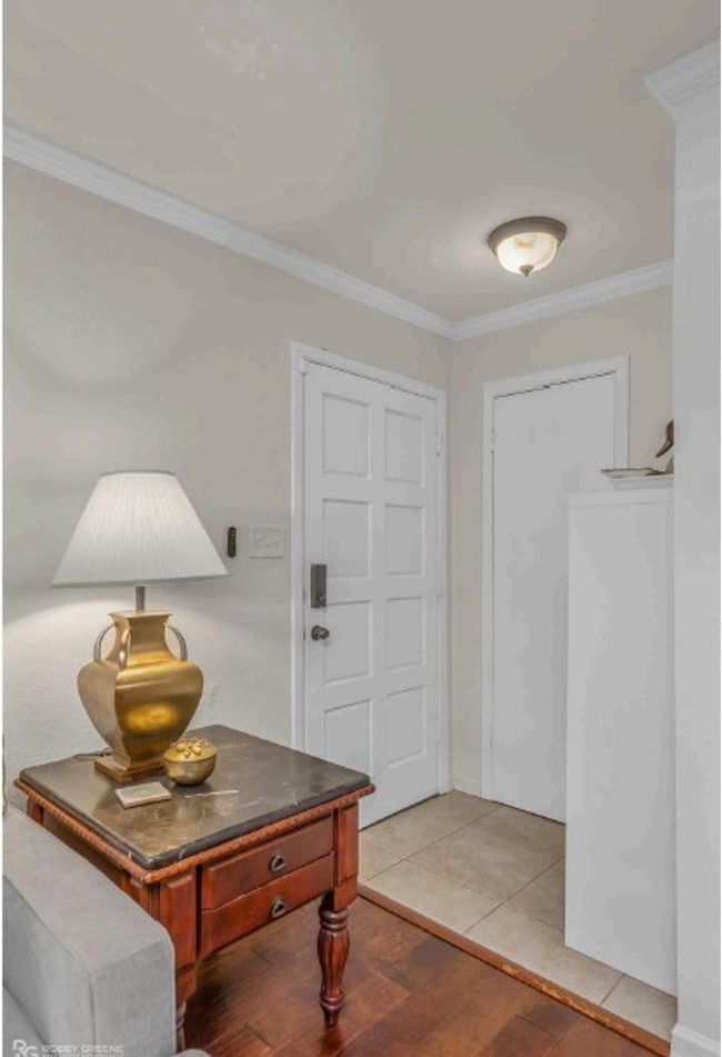 Entrance foyer with light wood-type flooring and crown molding | Image 9