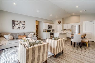 Living room with sink, high vaulted ceiling, and light hardwood / wood-style floors | Image 3