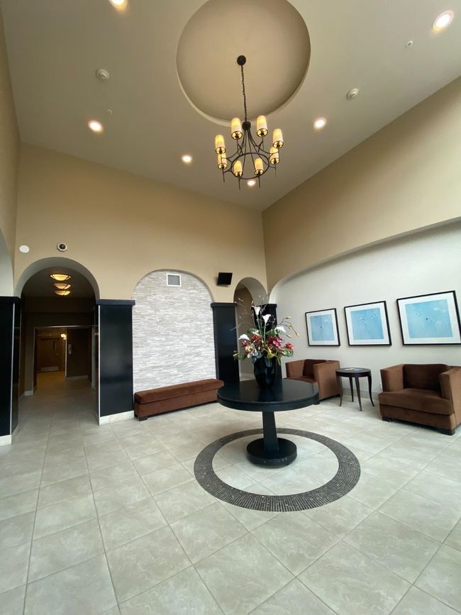 Building lobby with recessed lighting and a towering ceiling | Image 16