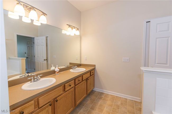 Full bathroom featuring double vanity | Image 6