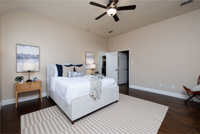 Bedroom with dark wood-style floors, high vaulted ceiling, and a ceiling fan | Image 16