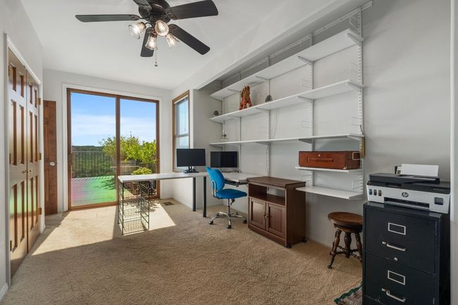 Main level bedroom used as an office. | Image 26