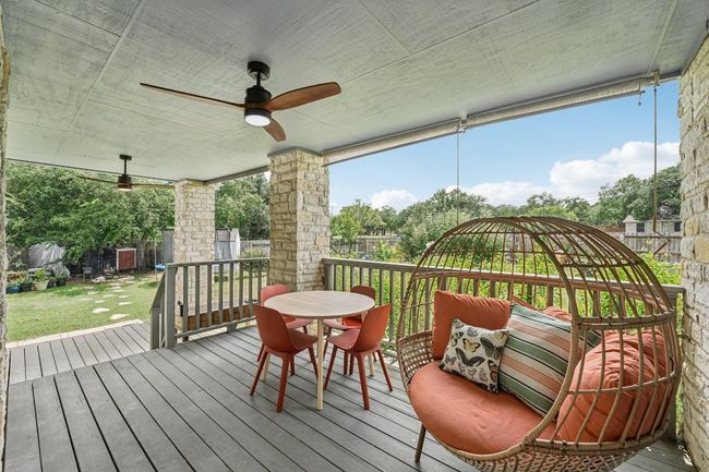 Wooden deck featuring ceiling fan and outdoor dining space | Image 31