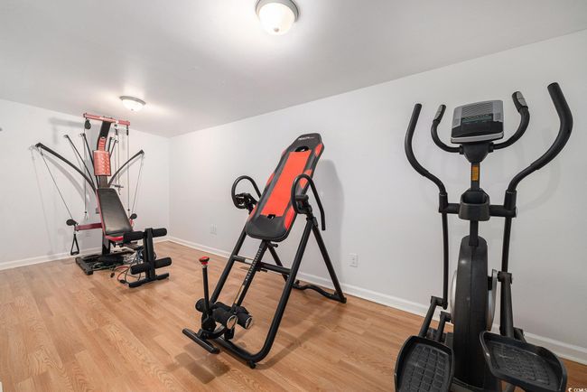 Workout area featuring light wood-style flooring | Image 21