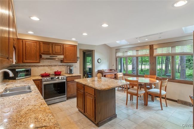 Skylights enhance the breakfast area | Image 16