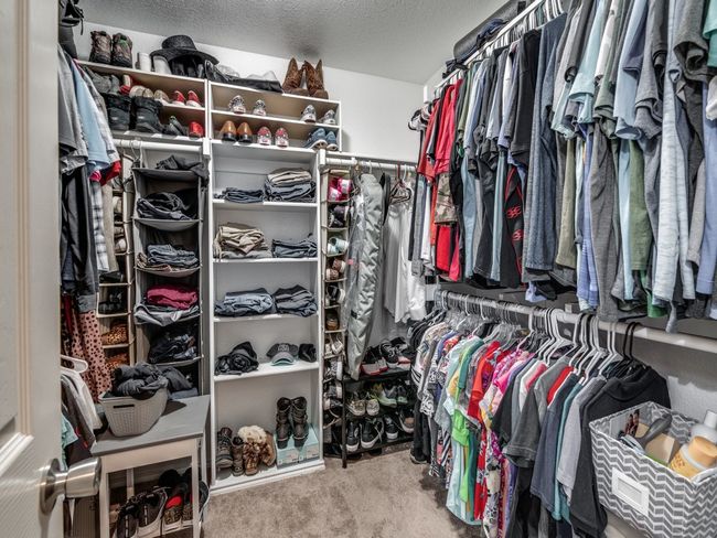 Spacious closet with carpet flooring | Image 19
