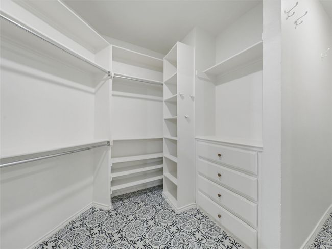 Walk in closet featuring light tile patterned floors | Image 10