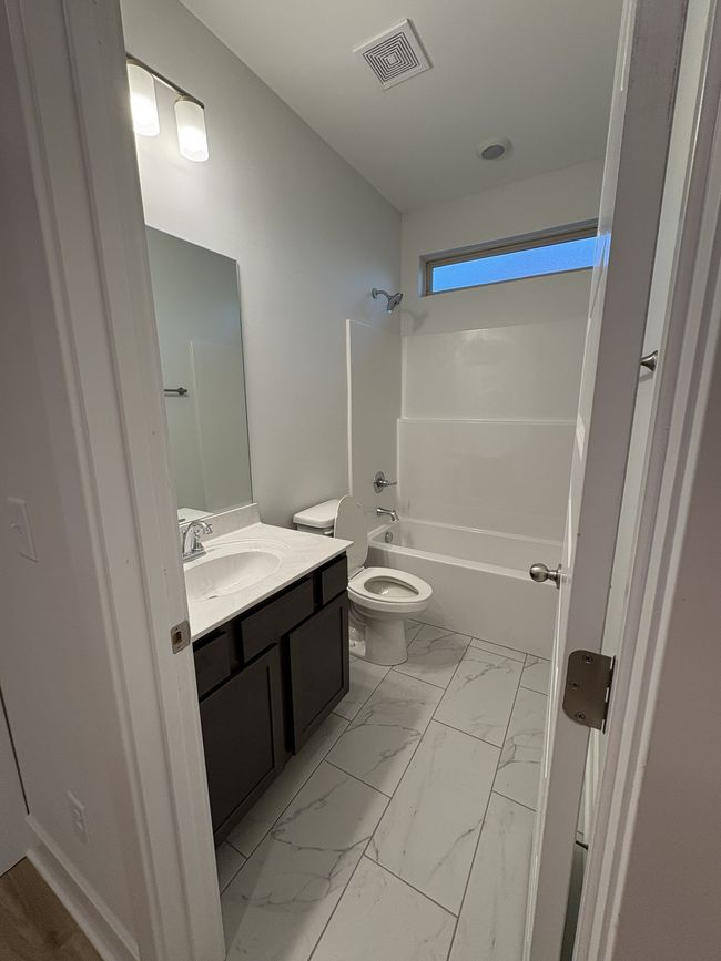 STOCK PHOTO. SELECTIONS WILL VARY IN ACTUAL HOUSE. Downstairs Full Bath | Image 4