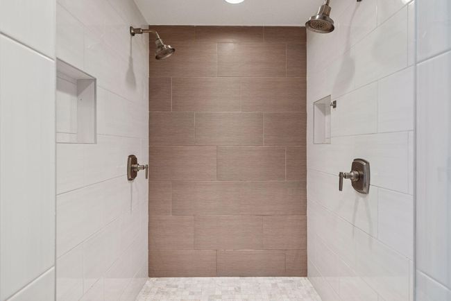 Lower level bathroom walk in shower with dual shower heads. | Image 34