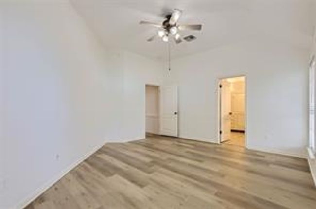 Unfurnished room with wood finished floors and a ceiling fan | Image 20