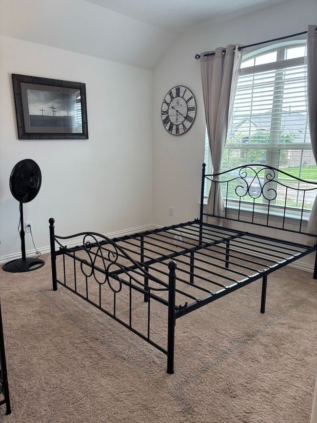 Unfurnished bedroom featuring carpet floors and lofted ceiling | Image 18