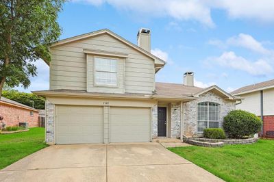 Front of property with a garage and a front yard | Image 2