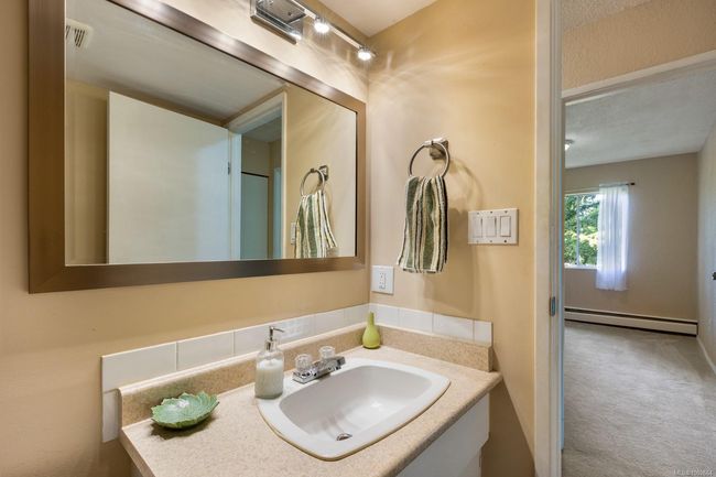 Bathroom with baseboard heating and vanity | Image 22