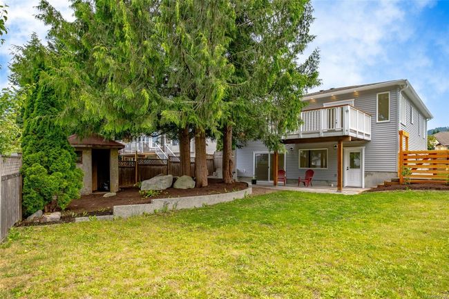 Fully fenced backyard with Garden shed | Image 97