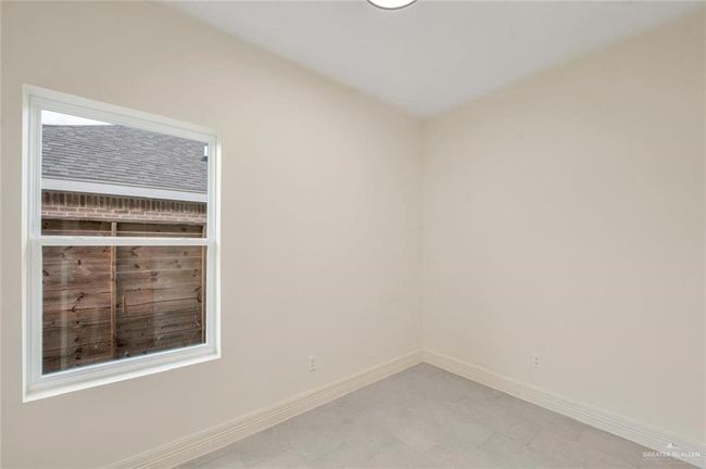 Unfurnished room with baseboards | Image 9
