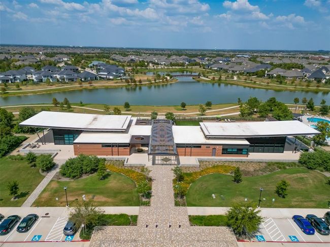Features a single-family home with a spacious yard in Bridgeland, a master-planned community offering lakes, pools, sidewalks, and green spaces. | Image 24