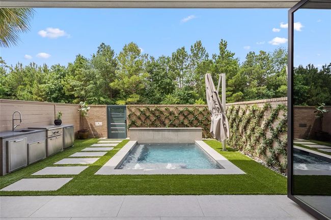 Embrace seamless indoor/outdoor living just steps from Memorial Park. The open-concept interior flows effortlessly to a private retreat with tree-lined views. All designed to maximize comfort and connection to nature in one of Houston’s most coveted green spaces. | Image 4