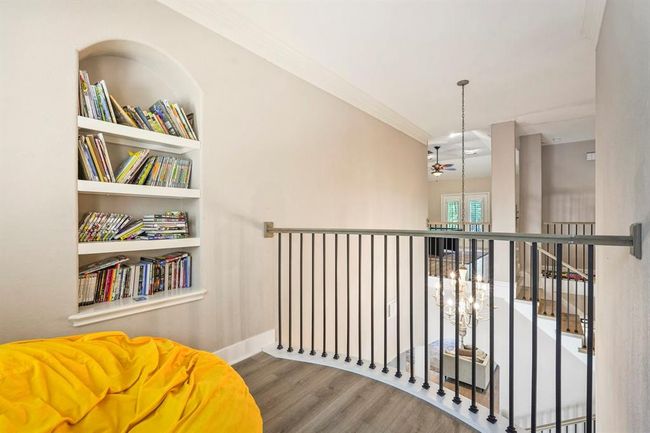 A cozy upstairs nook with built-in bookshelves right out of one of the bedrooms. | Image 38