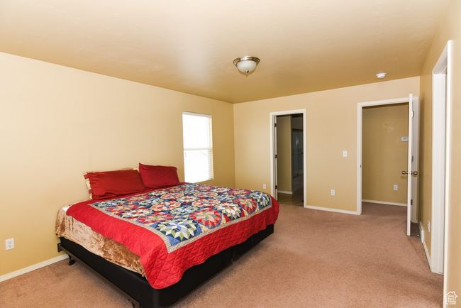 Bedroom with carpet and baseboards | Image 20
