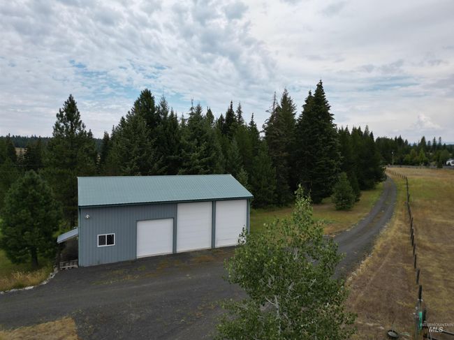 View of outbuilding featuring a forest view | Image 16