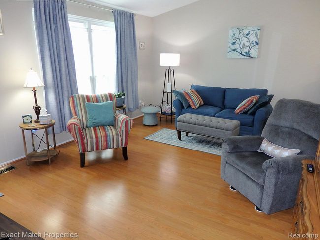 Beautiful laminate flooring and southern facing picture window. | Image 12