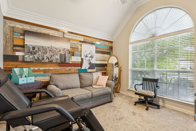 Living room with ornamental molding, carpet, lofted ceiling, and baseboards | Image 16