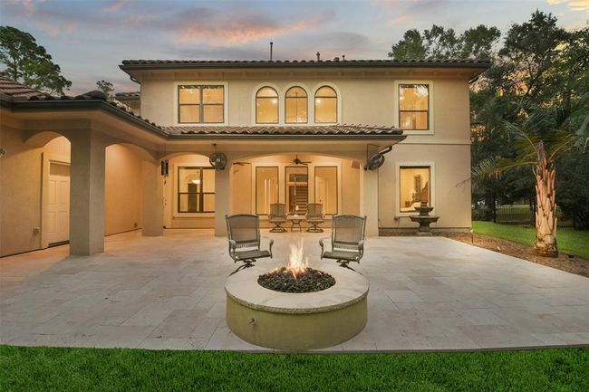 Other features include 25+ trees and palms, French drain, Gutters with leaf guards, and iron fence on 2 sides. A portable 15Kw, electric start, whole home generator (DuroMax XP15000E) stays with the house. | Image 39