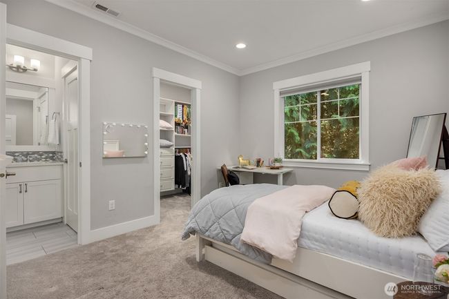 Bedroom 2 with a shared on suite bathroom and walk in closet. | Image 23