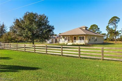 View of yard with a porch and a rural view | Image 3