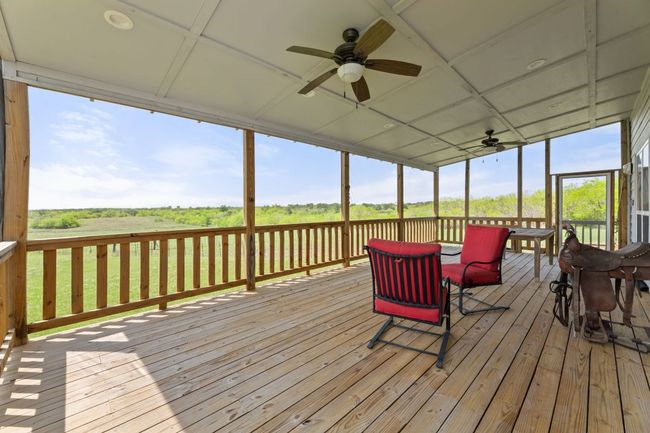 Wooden terrace with a ceiling fan | Image 22
